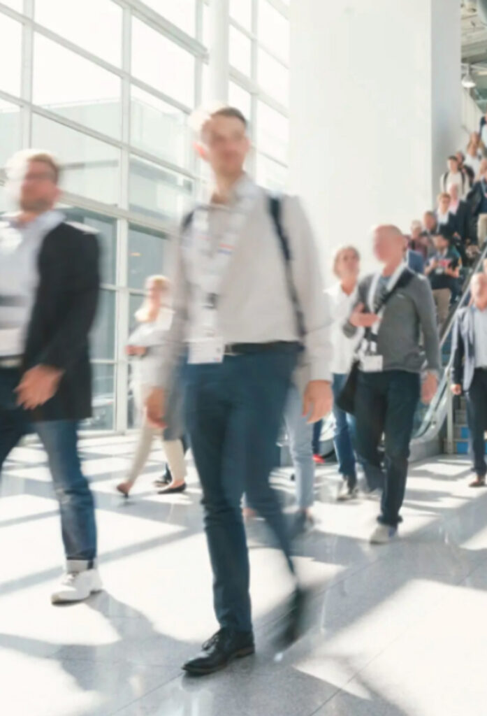 Attendees walking around the trade show.